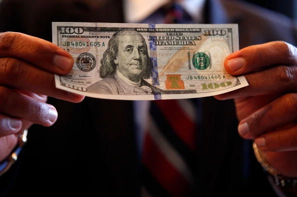 The debut of the new one hundred dollar bill. The debut of the new one hundred dollar bill.